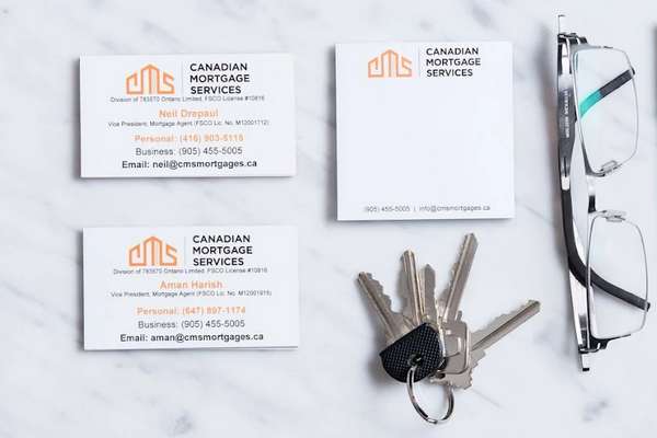 This is a photo of the business cards at Canada Mortgage Services.